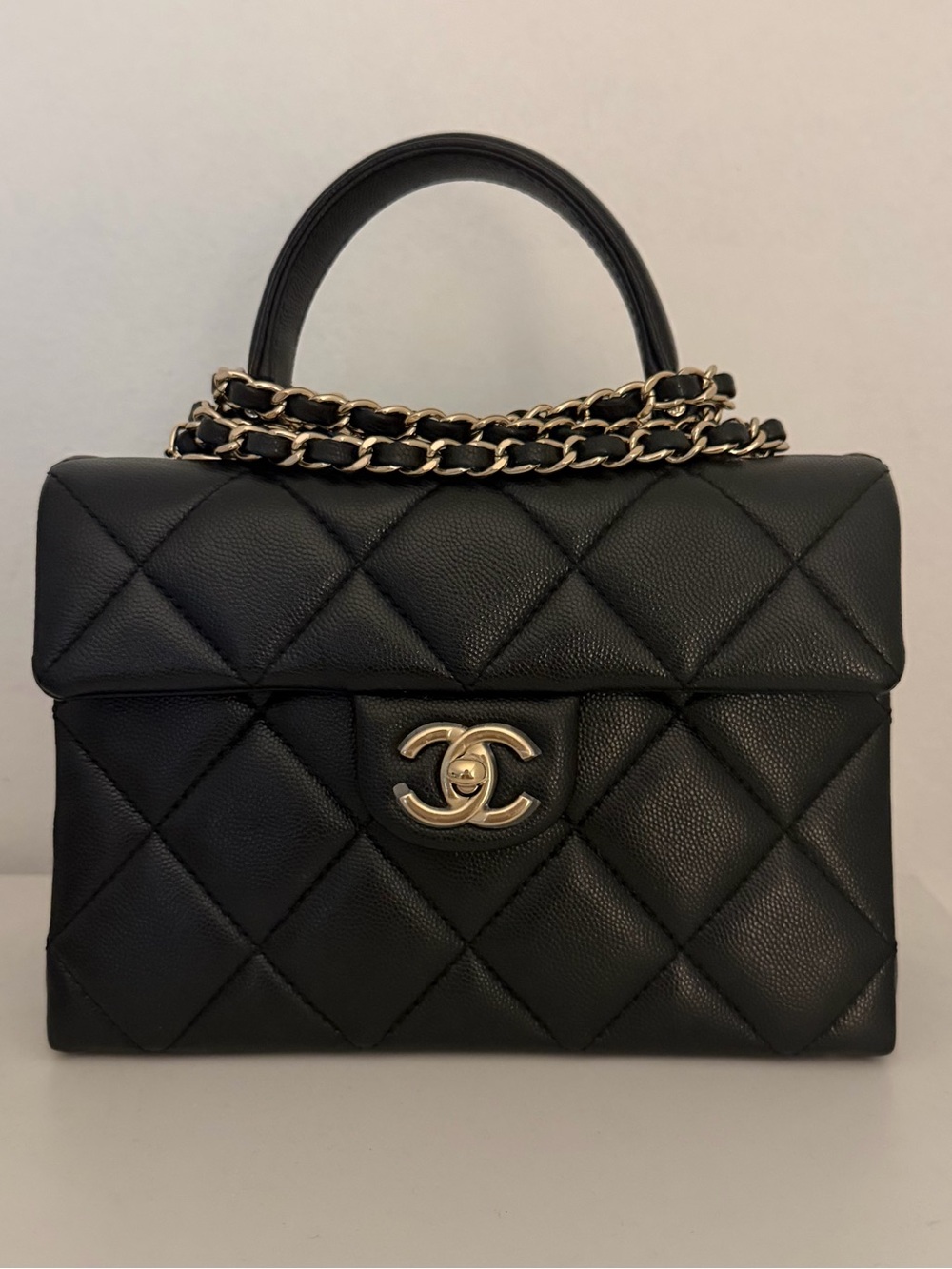 CHANEL Black Quilted with Gold-Tone CC Lock